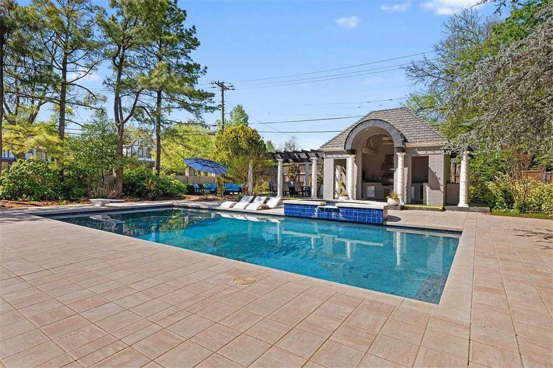 Pool and cabana on a sunny afternoon