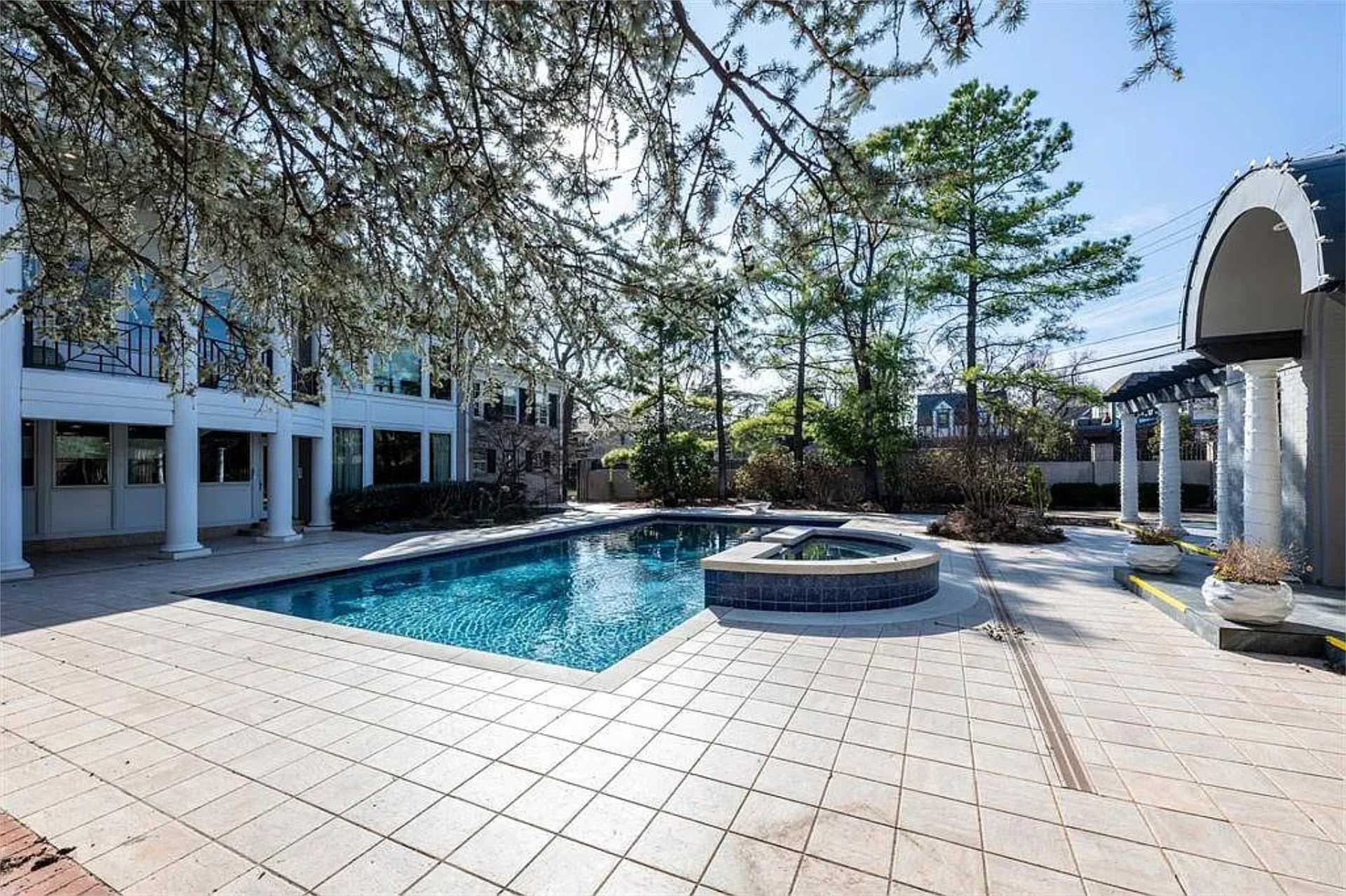 Pool and spa with arched pergola