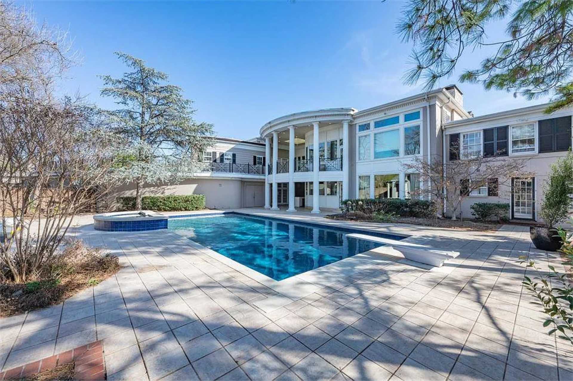 Rear elevation with columned colonnade overlooking the pool