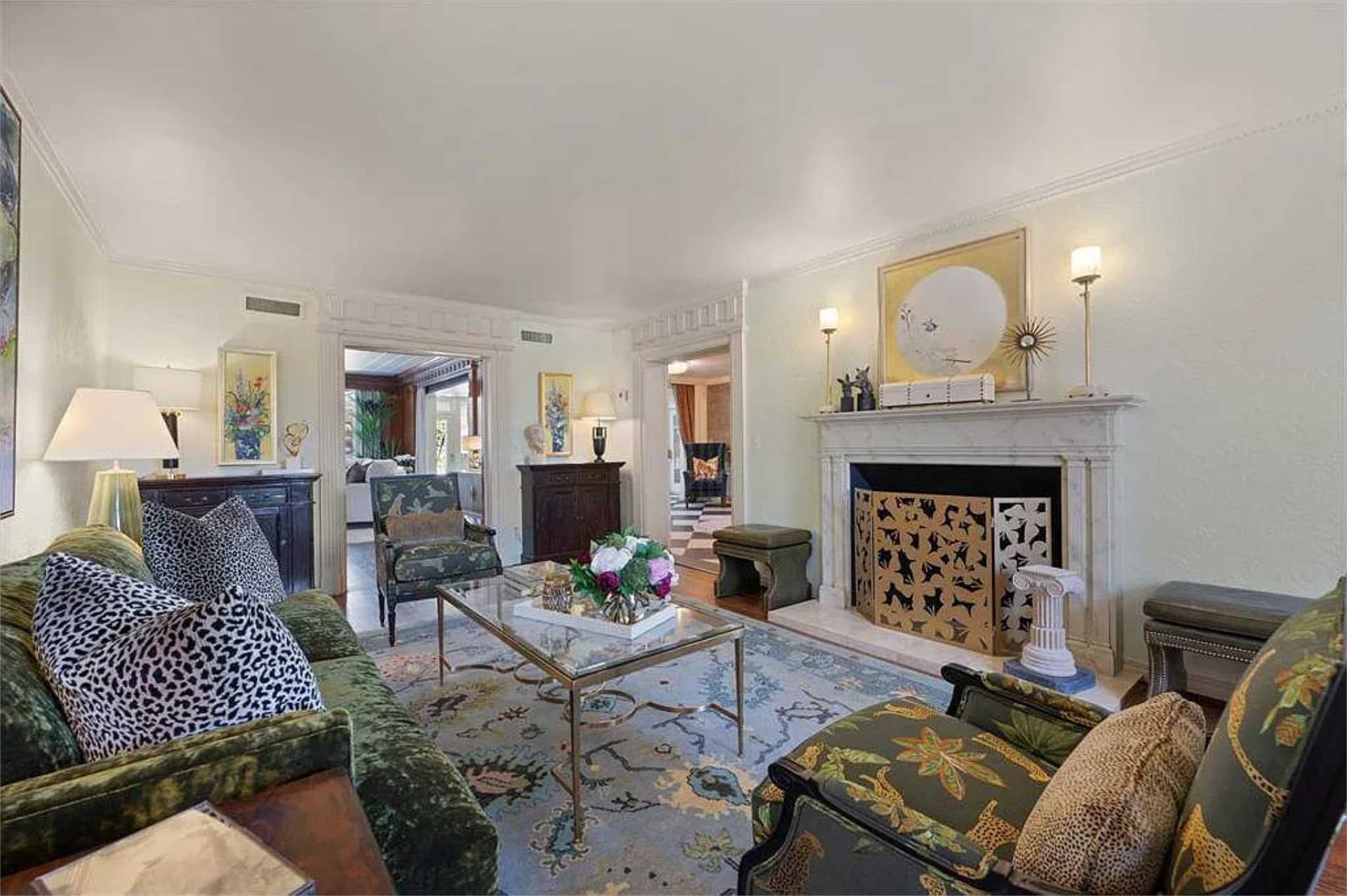 Sitting room with marble fireplace and antique furnishings