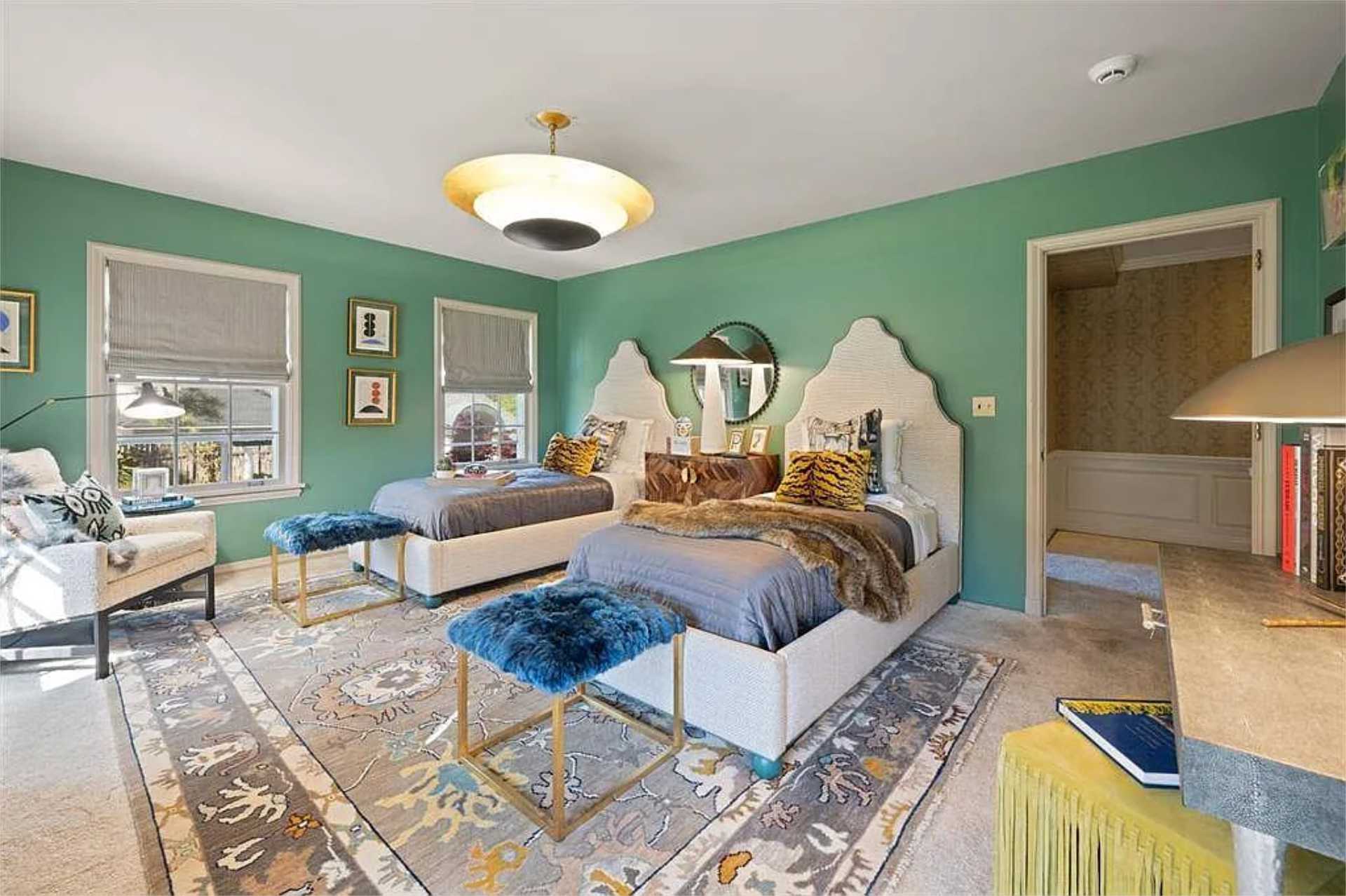 Guest bedroom with twin beds and arched headboards